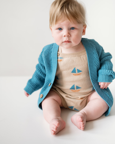 Baby Wearing Romper and Cardigan