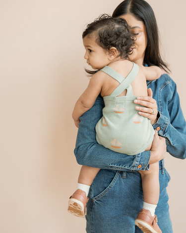 Baby in Romper With Mom