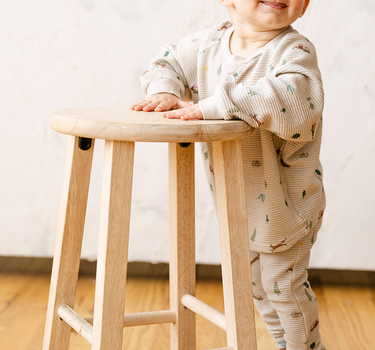 Image shows baby boy wearing organic cotton waffle long sleeve tee in camping. 