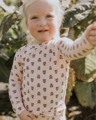 toddler girl wearing modal pajama set in light pink color with rose floral pattern