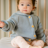 Image shows baby girl wearing pima cotton knit hoody in pearl blue. 