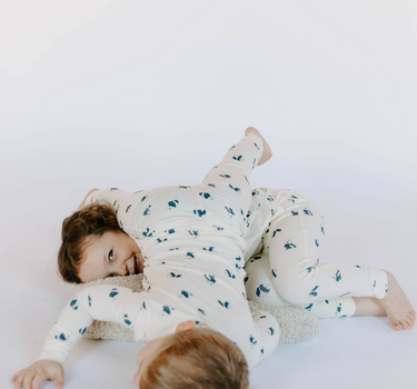 Image shows kids wearing modal pajama sets in panda print.